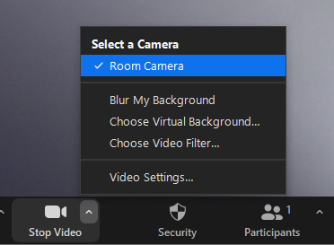 Select "Room Camera" or "AV Bridge" using the caret that appears on the "Stop Video" button at the bottom